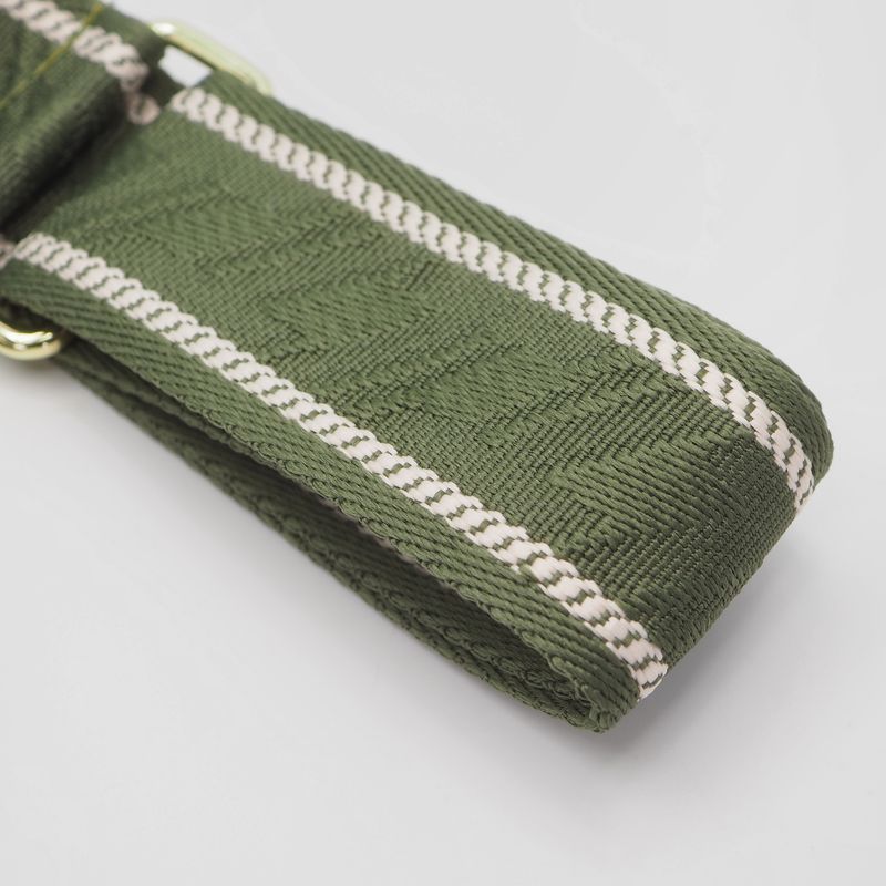 Veskestropp med houndstooth mønster med skinndetaljer oliven