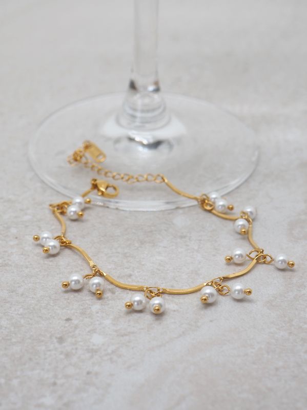 Armbånd med perlecharms
