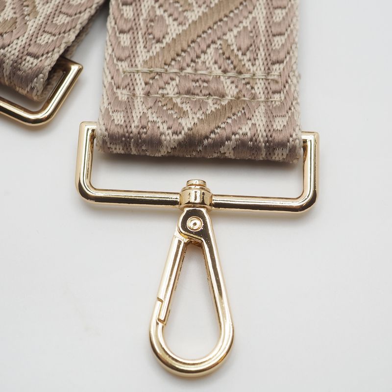 Veskestropp med geometrisk mønster krem beige